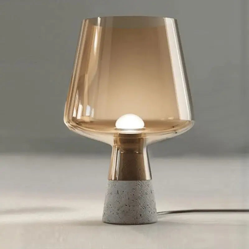 Juglana modern floor lamp with cement base and glass shade in a living room