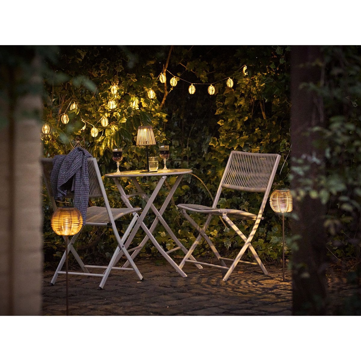 Guirlande à ampoules LED Carlisle, polyrattan/métal, nature/noir